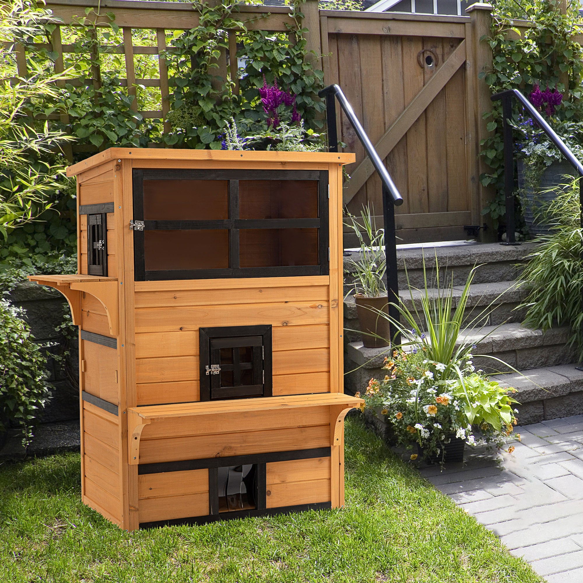 SunPaw 3-tier outdoor cat house back view with wooden tiers and black metal accents