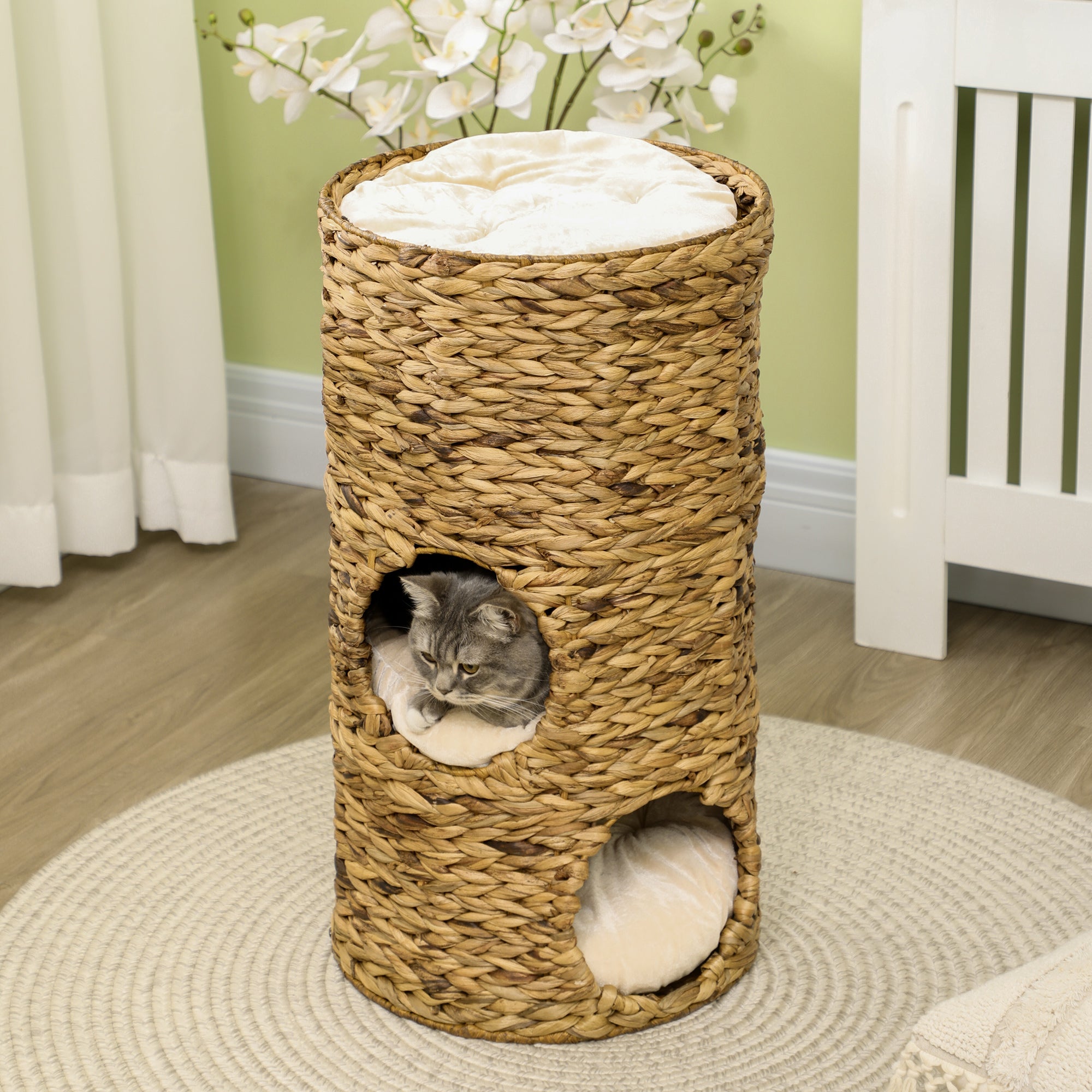 StackNest Elevated cat bed tower: tall seagrass cylinder with white cushioned hideaways and top perch